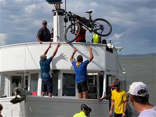 Photo of Tour Aotearoa 2023: rider Rich Truax, loading up Kaipara boat Pouto Point to Helensville